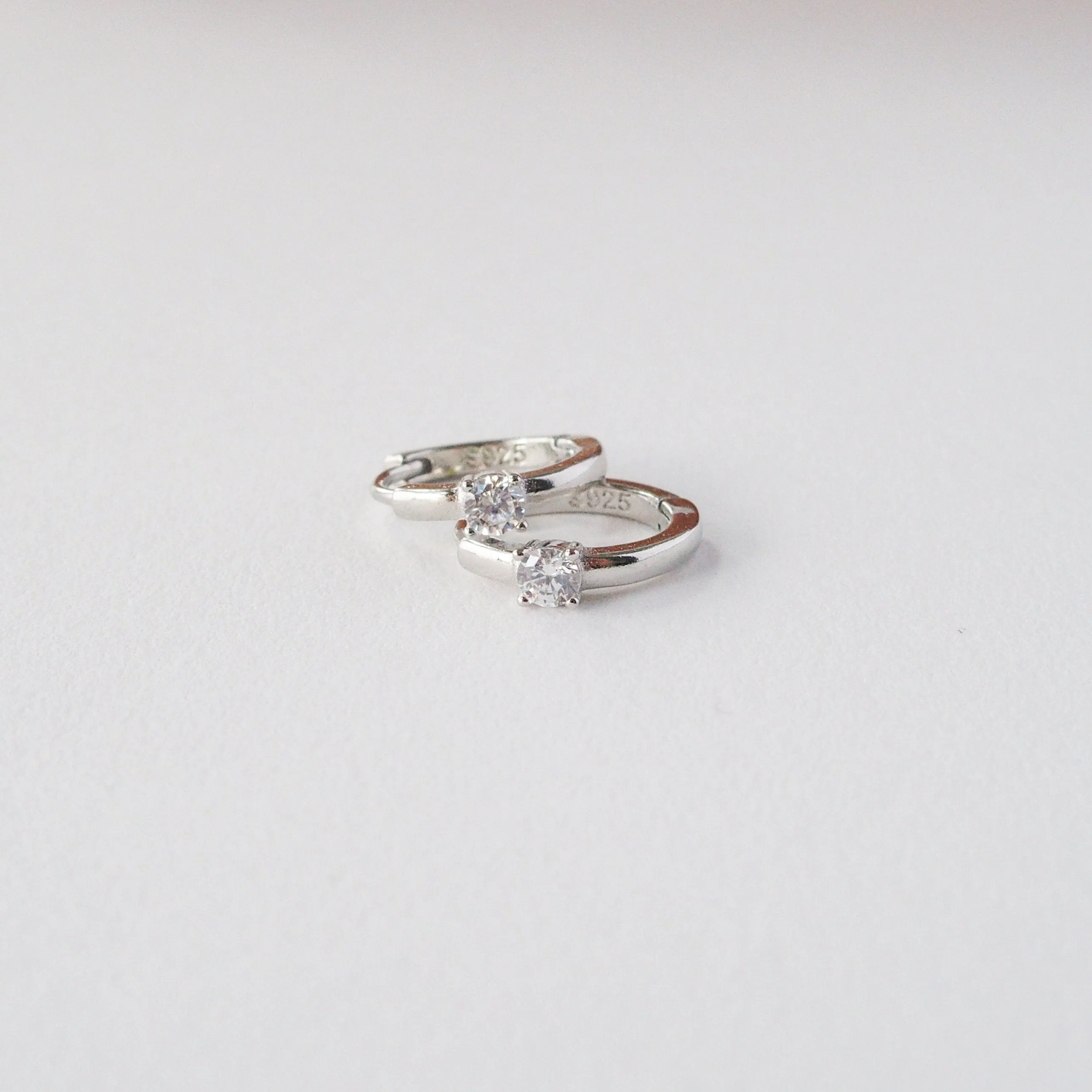 Solitaire Crystal Huggie Hoops in Silver