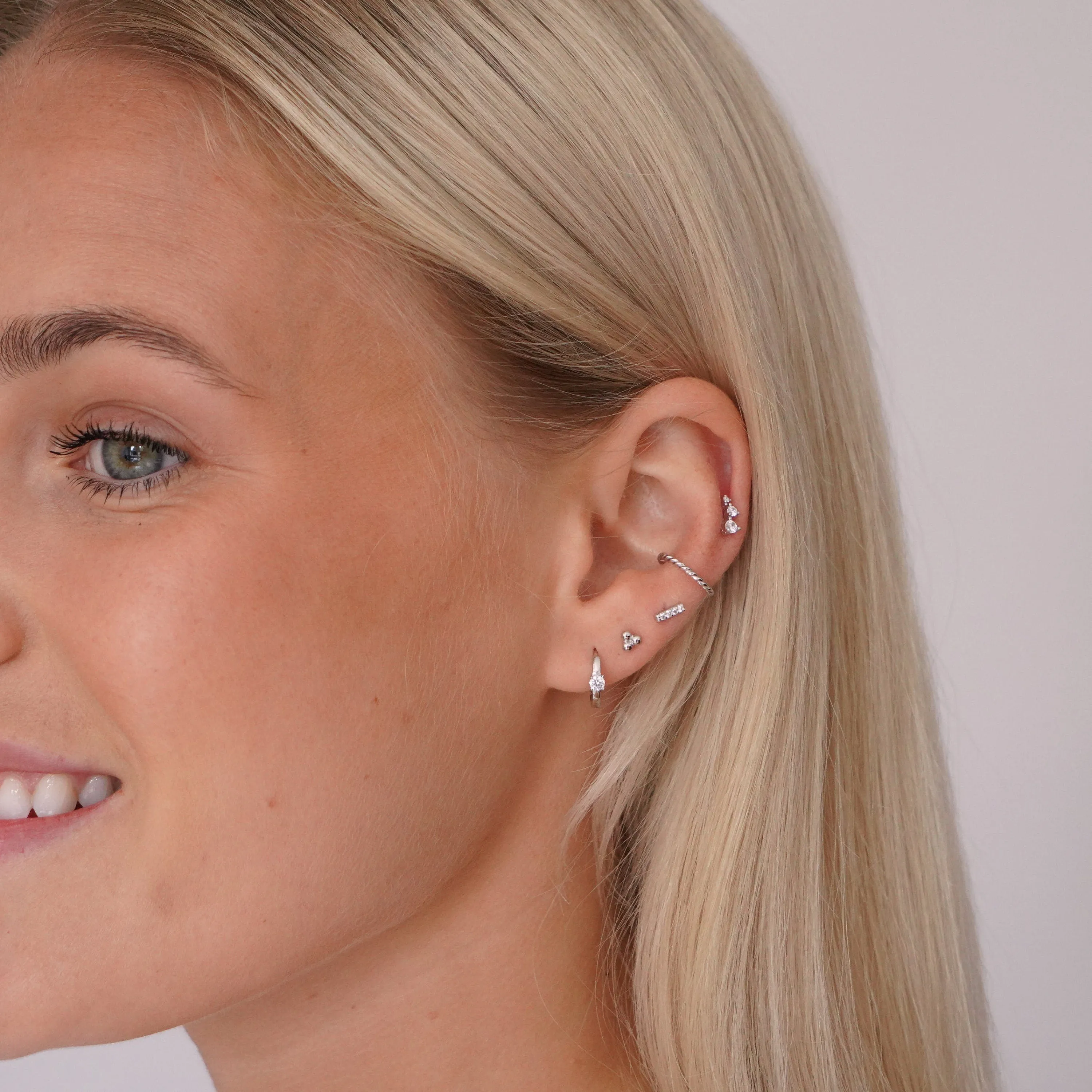Solitaire Crystal Huggie Hoops in Silver